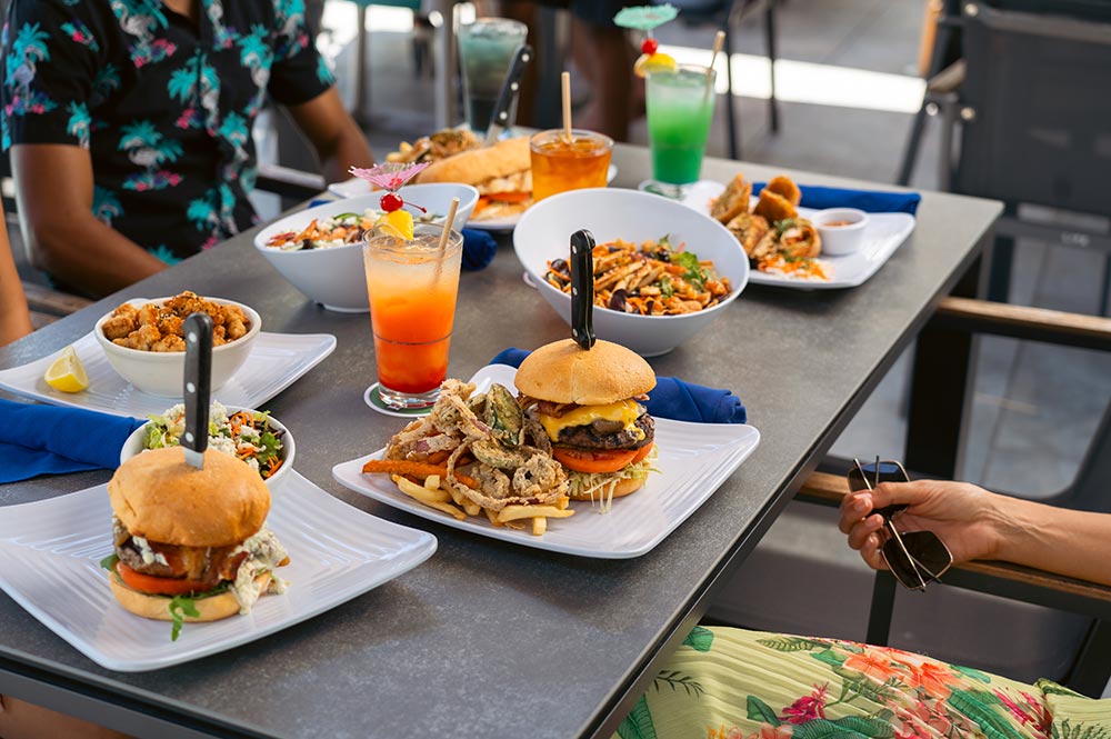 Sunshine Hotel & Suites | Sunshine Grill Food | Patio Table Sunshine Hotel & Suites | Sunshine Grill Food | Patio Table